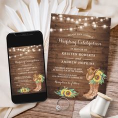 a wedding card with sunflowers and cowboy boots on it next to a phone