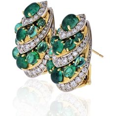 Crafted with meticulous attention to detail by the esteemed jewelry brand David Webb, these Platinum & 18K Yellow Gold Diamond and Green Emerald Earrings embody the essence of elegance and sophistication. Each piece tells a story of exquisite craftsmanship and timeless beauty, making them a perfect addition to any discerning woman's jewelry collection.The lustrous green emeralds, with their smooth cabochon finish, take center stage, exuding a captivating aura of natural allure. Expertly spaced b Luxury Oval Cluster Earrings For Formal Occasions, Luxury Oval Cluster Earrings For Anniversary, Luxury Gemstone Cluster Earrings For Formal Occasions, Luxury Cluster Earrings For Formal Occasions, Luxury Yellow Gold Cluster Earrings With Gemstones, Luxury Gemstone Cluster Earrings For Anniversary, Green Emerald Earrings, Emerald Green Earrings, Emerald Cut Diamond Ring