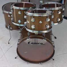 a group of drums sitting on top of a floor