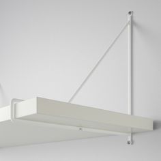 a white light fixture hanging from the ceiling