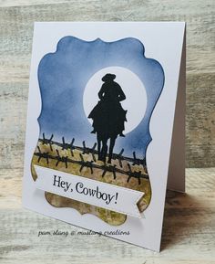 a card with a cowboy silhouette on it