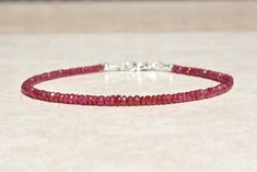 "Natural Ruby Bracelet, July Birthstone Bracelet, Beaded Gemstone Jewelry, Dainty Stacking Bracelet, Wife, Friend, Mothers Day Gift for Her -Please Note: My pictures are magnified to show detail. -Ruby is the birthstone for July. -The Ruby beads are approximately 3-3.5mm. -The clasp and findings are sterling silver, gold-filled, or rose gold filled. -Your purchase will be sent in a gift box. -A portion of this purchase will be donated to a Pug rescue or a Pug in need. -How to determine your brac Ruby Beaded Bracelets With Gemstone Beads As Gift, Gift Ruby Gemstone Beaded Bracelets, Red Rondelle Gemstone Beads Bracelets, Ruby Beaded Bracelets With Round Beads As Gift, Ruby Beaded Bracelets As A Gift, Ruby Beaded Bracelets With Round Beads For Gift, Handmade Ruby Bracelets As Gifts, Mini Bracelet, Bead Sizes