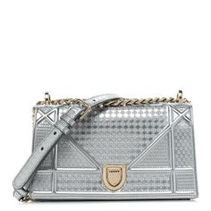 This authentic CHRISTIAN DIOR Metallic Patent Micro-Cannage Small Diorama Flap Bag in Silver. This chic bag is composed of finely detailed patent calfskin. The bag features a gold chain-link shoulder strap and a leather shoulder strap.The decoratively embossed facing flap opens with a gold texturedpress lock to a black leather interior with zipper and patch pockets. Luxury Silver Shoulder Bag With Gold-tone Hardware, Silver Luxury Shoulder Bag For Everyday, Luxury Metallic Shoulder Bag With Palladium Hardware, Luxury Metallic Rectangular Bags, Luxury Metallic Top Handle Bag, Luxury Gold Bag With Glossy Finish, Luxury Gold Bags With Glossy Finish, Luxury Glossy Gold Bag, Luxury Gold Glossy Bag