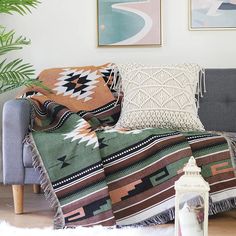 a living room with a couch, rug and pictures on the wall