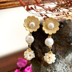 These beautiful earrings are handmade from scratch - they are 24K gold plated over brass, completed with real pearls.  The floral shape of the earrings make pearls a little more casual - a perfect way to add a twist to your daily outfits. These lovely earrings also make a great little gift for your loved ones!  The ear wires are pure brass which is nickel-free and hypoallergenic which makes them perfect for those with sensitive ears. Rest assured that your order will reach you safe and sound as all items are wrapped in bubble wrap and sent securely in a box. Have a great day! Real Pearls, Lovely Earrings, Bridal Pearls, Daily Outfits, Jewelry Earrings Studs, Little Gifts, Beautiful Earrings, From Scratch, Etsy Earrings