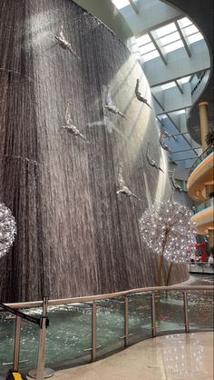 an indoor waterfall in the middle of a mall