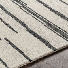 an area rug with black and white lines on it, showing the width of each piece