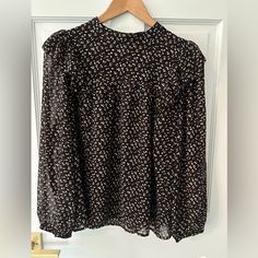 Nwt Madewell Black Floral Ruffle Shoulder Long Sleeve Blouse Sz L Black, White, Brown And Yellow Small Floral Pattern Ruffle Shoulders Long Sleeve Black Lining Button Neck Closure 22 Inch Bust 23.5 Inch Length (Shoulder To Hem) Black Blouse With Ruffled Collar For Fall, Black Ruffled Collar Blouse For Fall, Black Floral Print Blouse For Fall, Small Floral Pattern, Madewell Shirts, Black Floral Top, Black Blouse Long Sleeve, Balloon Sleeve Blouse, Pleated Sleeves