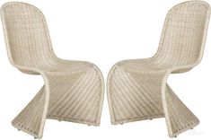 two white wicker chairs sitting next to each other