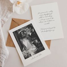 two wedding cards on top of each other next to an envelope with the same photo