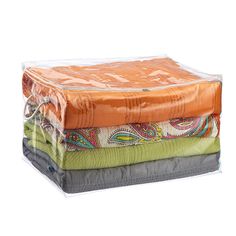 four different colored blankets stacked on top of each other