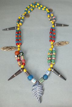 This necklace with glass beads and different amulet pendants originates from Nepal. The hanging length of the strand is 30 cm. The diameter of the beads is 0.7 cm to 1.5 cm. The pendants are 2 cm to 5.5 cm long. Its weight is 145 gram. (e7) SHIPPING SHIPMENT is FREE. All items are shipped within two working days after receipt of payment. We send everything by registered airmail. Insured packets (over 50 cm length / over 1500 gram) I send by standard way. PAYMENT Paypal is preferred. RETURN POLIC Wooden Beads Amulet Jewelry For Festival, Colorful Beads Amulet Pendant Necklace, Colorful Beaded Amulet Pendant Necklace, Festival Amulet Jewelry With Wooden Beads, Amulet Style Jewelry With Wooden Beads For Festival, Festival Amulet Style Jewelry With Wooden Beads, Healing Festivals Necklace With Wooden Beads, Wooden Beads Amulet Pendant Jewelry, Multicolor Amulet Beaded Necklaces For Festivals