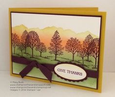 a handmade card with trees on it and a ribbon around the edge that says give thanks