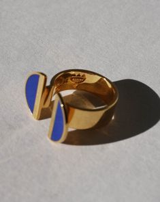 Indulge in elegance with our 24K Gold Vermeil Split Top Crescent Lapis Enamel Ring, a captivating piece from the Diasporan Voyage Collection. Crafted in collaboration with Chee Lee Designs, this ring features a unique split top design in 24K Gold Vermeil , adorned with lustrous crescents in lapis enamel. This ring is a statement of modern style interwoven with the rich tapestry of African heritage. Experience the fusion of luxury and cultural significance with this timeless addition to your jewelry collection. Lapis blue enamel 24K Vermiel Don't see your size? Don't worry these can be made to order. Email us at marcheruedix@gmail.com for inquires. Crescent Ring, Split Top, African Heritage, Lapis Blue, Enamel Ring, Top Design, Don't Worry, Gold Vermeil, Crescent