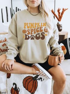 Pumpkin Spice And Dogs Sweatshirt, Retro Fall Sweatshirt, Fall Coffee and Dogs Shirt, Gift for Her, Pumpkin Spice Shirt, Dog Lover Shirt, Fall Dogs and Pumpkin Spice Sweatshirt, Spooky Season, Dover Lover Gift Our shirts are made to order specially for you. Because of this reason we don't accept returns or exchanges. Please check our color and size charts before you place your order. If you have any questions please send us a message to clarify sizing or colors. Ideal for any situation, a unisex heavy blend crewneck sweatshirt is pure comfort. These garments are made from polyester and cotton. This combination helps designs come out looking fresh and beautiful. The collar is ribbed knit, so it retains its shape even after washing. There are no itchy side seams on these sweaters. ✨ Gildan B Long Sleeve Cotton T-shirt With Dog Print, Cotton Long Sleeve T-shirt With Dog Print, Fall Long Sleeve Tops With Dog Print, Fall Crew Neck Top With Dog Print, Casual Long Sleeve T-shirt With Dog Print, Casual Long Sleeve Dog Print Tops, Fall Cotton Sweatshirt With Dog Print, Long Sleeve Dog Print T-shirt For Fall, Cotton Dog Print Sweatshirt For Fall