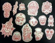 various stickers on a black surface with red and white ink, depicting different types of tattoos