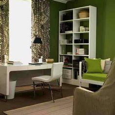 a green and white room with a desk, chair, bookshelf and bookcase