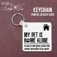 a keychain that says, my dog is home alone in case of emergency please find contact information in my wallet