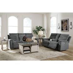 a living room with two recliners and a coffee table