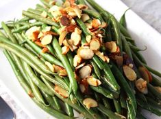 green beans and almonds on a white plate