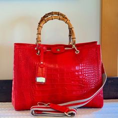 This Stunning Crimson Red, Croc Embossed Italian Leather Bag Is Large, Allowing For Multiple Uses As A Satchel, Shoulder Bag, Or Weekender. Nwot Faux Bamboo Satchel Handles With Separate Cloth And Leather Shoulder Strap + Fab Silver Hardware Triple Compartmet Center Zip And Snap Closure Very Roomy - Plenty Of Space For Laptop, Water Bottle, Etc. Nwot - Received As Gift - Never Used - No Known Flaws Approx Measurements: 15.25 X 11.25 X 7 (Grab It Now Before I Change My Mind!!) From Smoke Free, Pe Red Luxury Shoulder Bag For Daily Use, Red Luxury Bags With Leather Handles, Luxury Red Bags With Leather Handles, Luxury Red Shoulder Bag With Handles, Luxury Red Satchel For Daily Use, Luxury Red Bags For Everyday Use, Designer Red Satchel With Double Handle, Classic Red Satchel With Leather Handles, Red Top Handle Satchel With Leather Handles