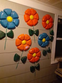 colorful flower decorations on the side of a building