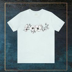 Embrace simplicity and elegance with our Minimalistic White Wildflowers Unisex Jersey Short Sleeve T-shirt. This timeless tee features a clean and minimalistic design of white wildflowers, offering a versatile and sophisticated look. #11 Boho Classic unisex jersey short sleeve tee fits like a well-loved favorite. Soft cotton and quality print make users fall in love with it over and over again. Ribbed knit collars to bolster shaping. Shoulders are tapered for a better fit over time. Dual side seams hold the garment's shape for longer. Fabric Details Made with 100% Airlume combed and ring-spun cotton, a lightweight fabric (4.2 oz/yd² (142 g/m²)) that is easy to layer, breathable. Perfect for active and leisure wear. Style Features The retail fit is perfect for casual and semi-formal setting White Botanical Style T-shirt For Summer, White Minimalist T-shirt For Spring, Minimalist Short Sleeve T-shirt For Spring, White Botanical Shirt With Relaxed Fit, White Botanical T-shirt With Floral Print, Simple Crew Neck Shirt For Spring, White Botanical Floral Print T-shirt, White T-shirt With Botanical Print, White Botanical Crew Neck Top