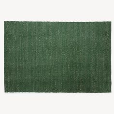 a green rug on a white background