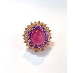 Bochic “Orient” Ruby, Amethyst & Multi Gem Cocktail Ring In 18K Gold & Silver    Natural Red Ruby Cabochon - 7 Carat  Natural Orange Sapphires - 1.50 Carat  Natural Amethyst - 4 Carat  Natural White Topaz - 2 Carat    This Ring is from the "Orient" traveling collection are the epitome of elegance and versatility. It offers a perfect blend of day to night and swimwear to evening wear, allowing you to effortlessly transition between different occasions and outfits.  Wearing these spectacular orien Luxury Purple Multi-stone Sapphire Ring, Orange Sapphire, Center Of Attention, Natural Tanzanite, Red Ruby, Evening Attire, Natural Red, 2 Carat, White Topaz