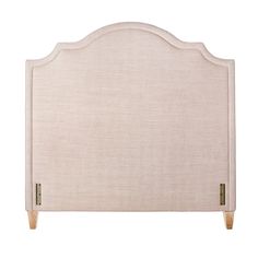 an upholstered headboard with wooden legs and beige linen fabric, on a white background