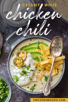 creamy white chicken chili in a bowl with tortilla chips and avocado