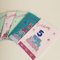 four birthday cards with the number five on each one and an envelope in the middle