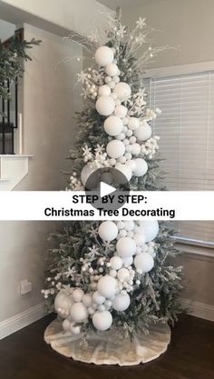 a christmas tree decorated with white balls and snowflakes is featured in this video