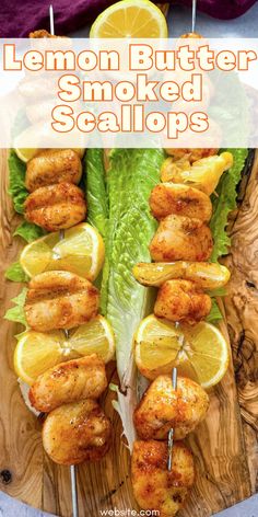 lemon butter smoked scallops on a cutting board with lettuce and lemon wedges