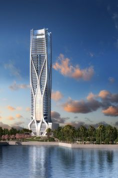 a tall white building sitting on top of a lake next to palm tree covered trees