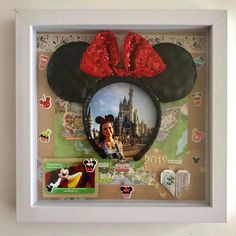 a mickey mouse head with red sequins on it and a photo in the middle