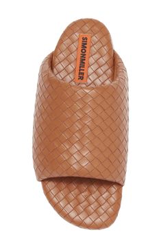 Supple faux-leather strips are woven to form the wide, puffy upper strap of this exceptionally comfortable slide sandal. Textile upper and lining/rubber sole Imported Designer Synthetic Slides Slip-on, Designer Synthetic Slip-on Slides, Designer Leather Slides With Textured Footbed, Casual Leather Slides With Woven Sole, Luxury Synthetic Slip-on Slides, Luxury Leather Slides, Comfortable Synthetic Mules With Woven Sole, Brown Synthetic Slide Sandals, Leather Slides With Woven Sole