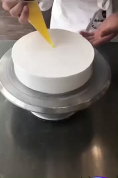 there is a cake that looks like a ballerina on top of a plate with snowflakes