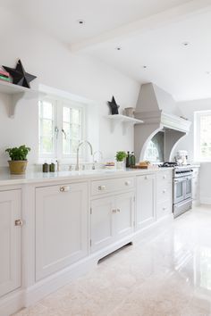 the instagram page shows an image of a kitchen with white cabinets