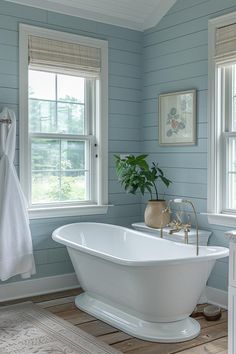 15 Gorgeous Shiplap Bathroom Styles To Impress Your Guests Pool Bathroom Ideas, White Clawfoot Tub, Coastal Bathroom Design, Farmhouse Bathroom Ideas, Blue Bathroom Decor, White Shiplap Wall, Coastal Bathroom, Blue Bath