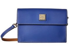 Dooney & Bourke Beacon East/West Flap Crossbody (French Blue/French Blue Trim) Cross Body Handbags. Complete your clean look with the sleek Dooney Bourke Beacon East/West Flap Crossbody handbag. Made of smooth leather. Flap with snap closure. Detachable  adjustable crossbody strap. Exterior back zip pocket. Signature logo engraved hardware detail at front. Flat bottom. Lined interior. Two interior slip pockets. Imported. Measu #Dooney&Bourke #BagsandLuggage #Handbag #CrossBody #Blue Blue French, Blue Trim, French Blue, East West, Dooney Bourke, Smooth Leather