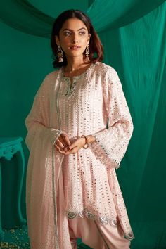 Powder pink short kurta with mirror, thread embroidery. Paired with a draped dhoti pant and dupatta with mukaish work. - Aza Fashions Elegant Mulmul Sharara For Festivals, Bollywood Style Kurta With Traditional Drape And Mirror Work, Traditional Drape Palazzo Set With Dabka Work For Navratri, Unstitched Palazzo Set With Mirror Work For Navratri, Eid Palazzo Set With Mirror Work In Traditional Drape, Festive Mulmul Sharara With Dabka Detailing, Bollywood Style Sets With Cutdana In Straight Kurta, Traditional Mulmul Sharara With Chikankari Embroidery, Bollywood Style Chikankari Embroidery Sets For Navratri