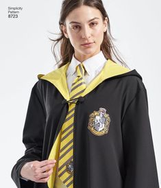 a woman wearing a harry potter costume with a yellow and black striped tie on her neck