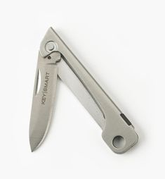 an open swiss army knife on a white background