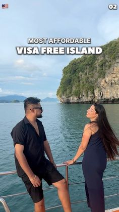 a man and woman standing on the deck of a boat looking at each other with text overlay that reads most affectionable visa free island