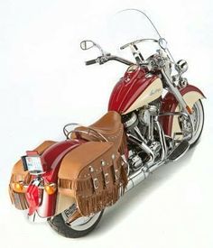 a red and tan motorcycle is shown on a white background with no people around it