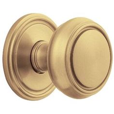 an antique brass door knob on a white background