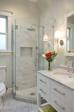 a bathroom with a sink, toilet and shower