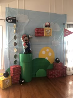 a nintendo themed room with mario and luigi on top of each other's blocks