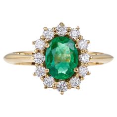 Classic Cluster Ring 18kt Yellow Gold with Oval Emerald 1.34 Carat and Diamonds A rare emerald give a stylish sense to your appearance. Classic beauty in this ring. IN STOCK AT SIZE Stone details: Emerald, oval mix cut, 1.34 Catat, diamonds brillant cut, 0.51 Carat. Collection: Metalloplasies Information: Limited Edition THE DESIGNER Talented and knowledgeable, Nicofilimon (aka Nikos Garbis) uses his creativity to embrace jewelry design as the noble form of craftsmanship that it is. His studies in jewelry design, gemology and the art of diamonds harmoniously blend with his training in classical music, jazz and composition, turning his artistic inspiration into a profound vision of beauty. Each and every one of his creations reflects a fragment of his influences while, at the same time, it Classic Yellow Gold Emerald Ring With Halo, Luxury Green Oval Cluster Ring, Oval Yellow Gold Emerald Ring With Halo, Classic Green Diamond Halo Ring, Gia Certified Oval Emerald Cluster Ring, Gia Certified Oval Emerald Ring In Yellow Gold, Classic Green Emerald Ring With Halo, Oval Emerald Ring In Yellow Gold With Halo Setting, Classic Green Cluster Ring With Halo